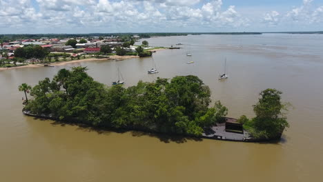 Old-convict-shipwreck-covered-with-vegetation-Mana-river.-Aerial-view-Guiana